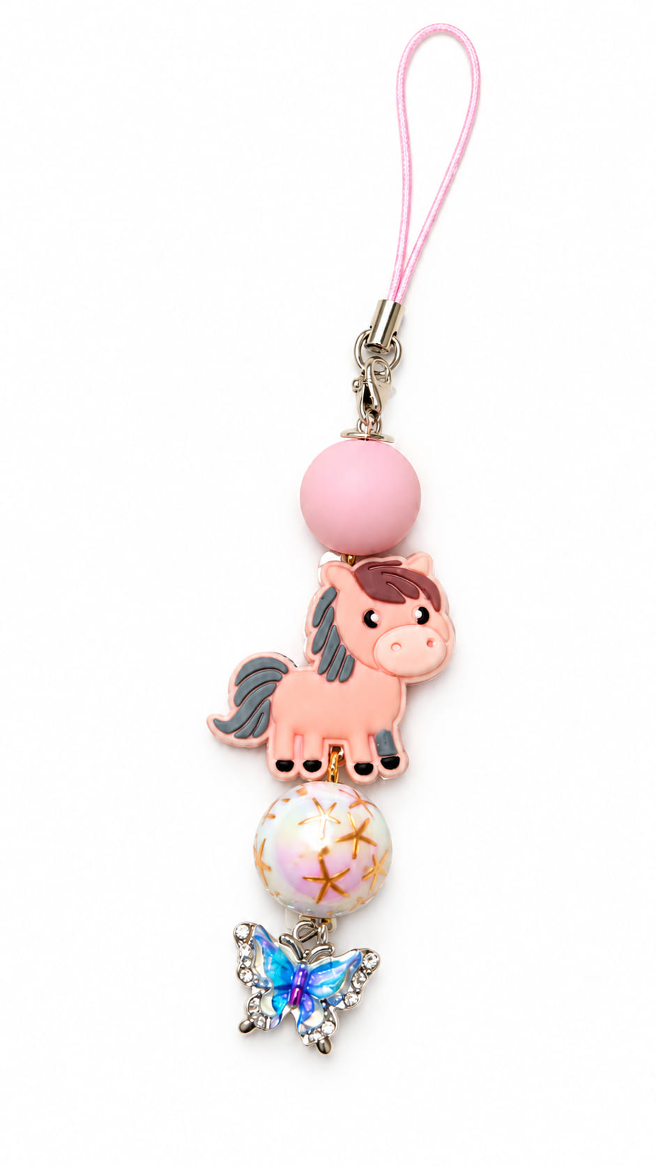 Handmade pony phone and bag charm featuring a matte pink silicone bead, iridescent gold-starred bead, and a crystal butterfly charm on a light pink loop cord.
