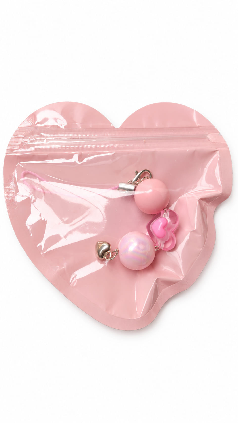 Handcrafted pink bridal heart bag charm neatly packed inside a matte pink heart-shaped zip lock gift pouch