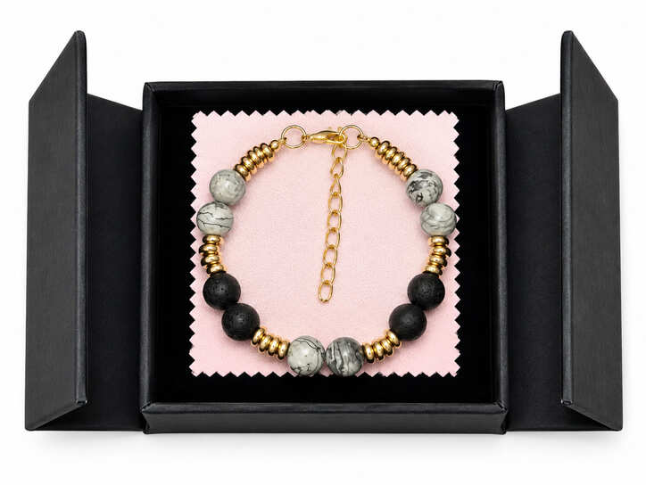 Genuine Lava Stone and Map Jasper diffuser bracelet presented in a black jewellery gift box with soft pink insert