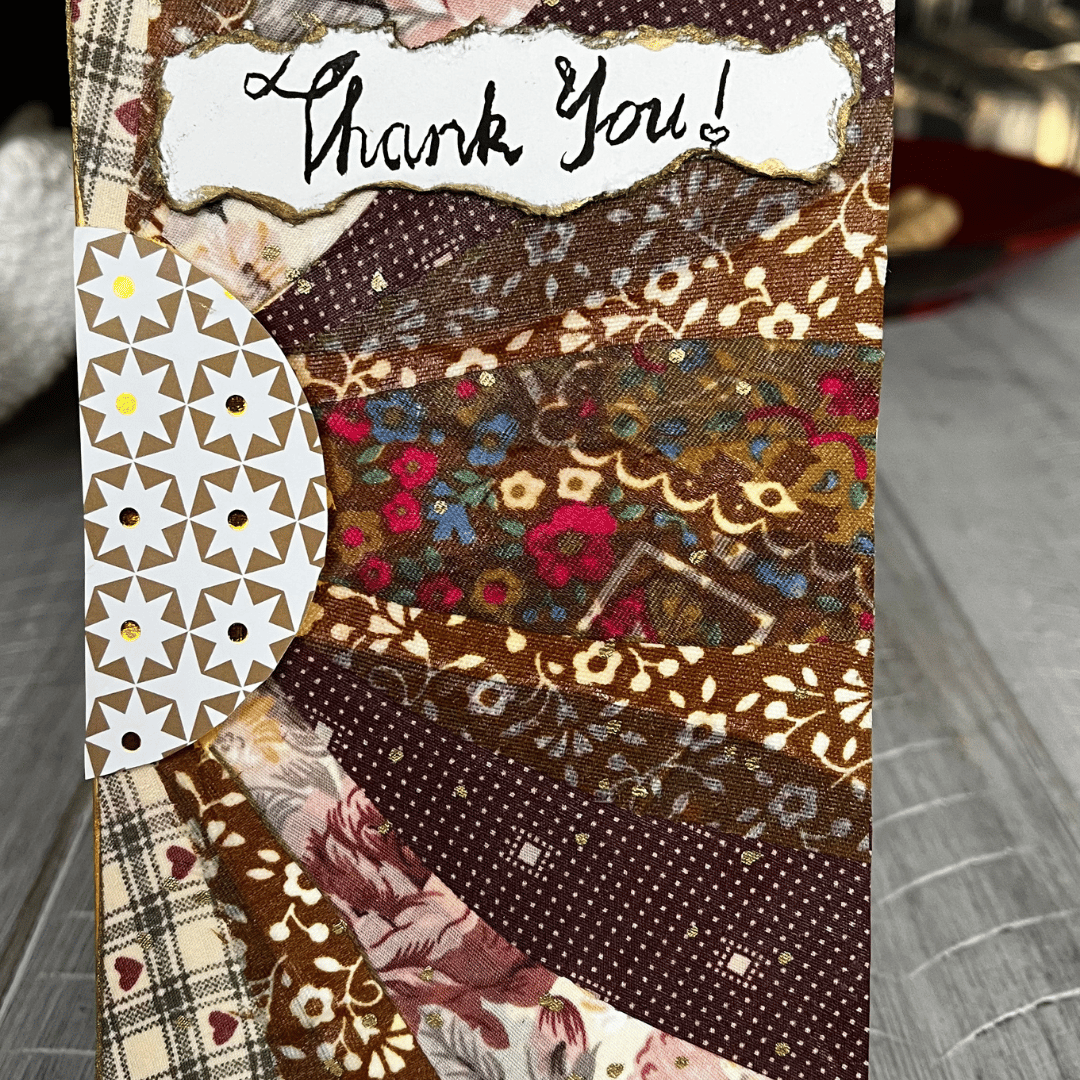 An abstract fabric card. The artwork is made to look like a multi-coloured sunflower.