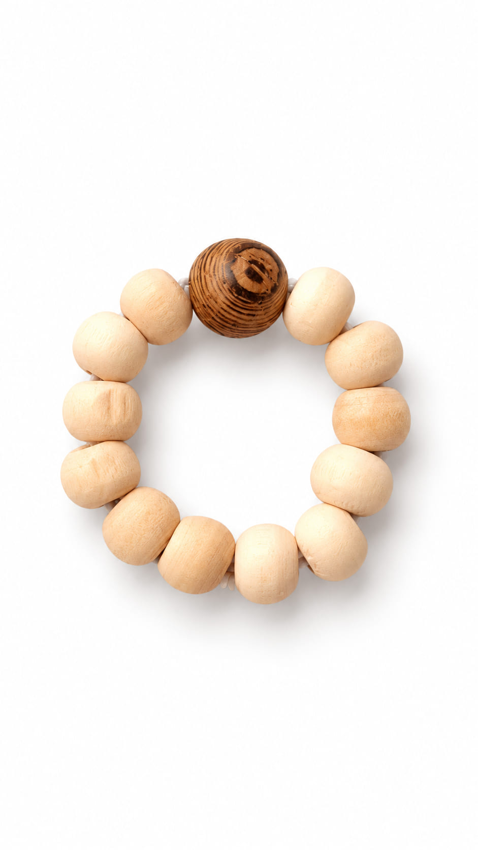 Natural wooden stretch ring with pale rounded beads and a contrasting dark wood-grain statement bead on a white background.