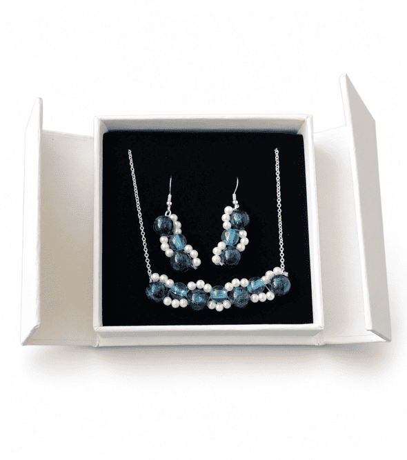 Ocean blue necklace and matching earrings presented in a white jewellery gift box with black insert