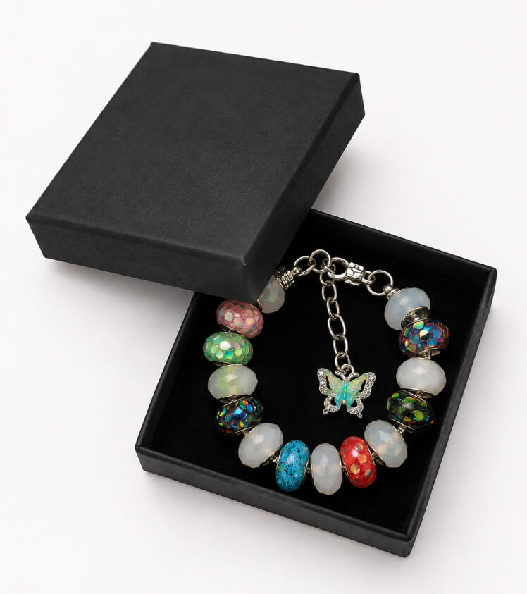 colourful butterfly charm bracelet presented in a black gift box