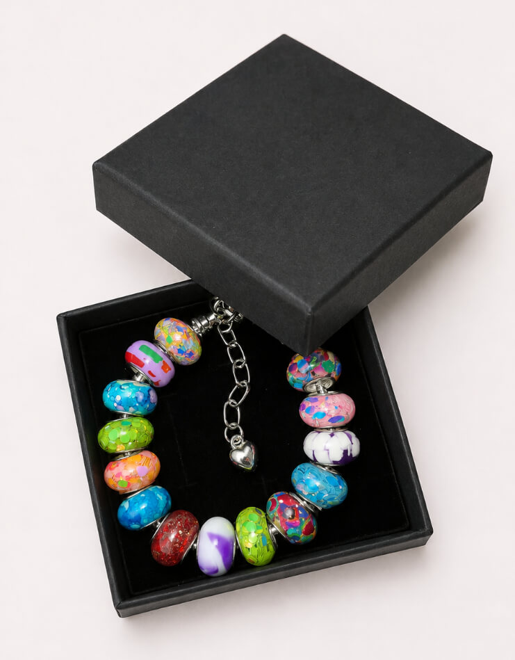 Rainbow Confetti European charm bracelet presented in a black gift box