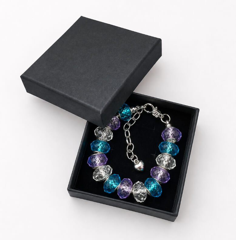 Blue and purple European charm bracelet presented in a black gift box