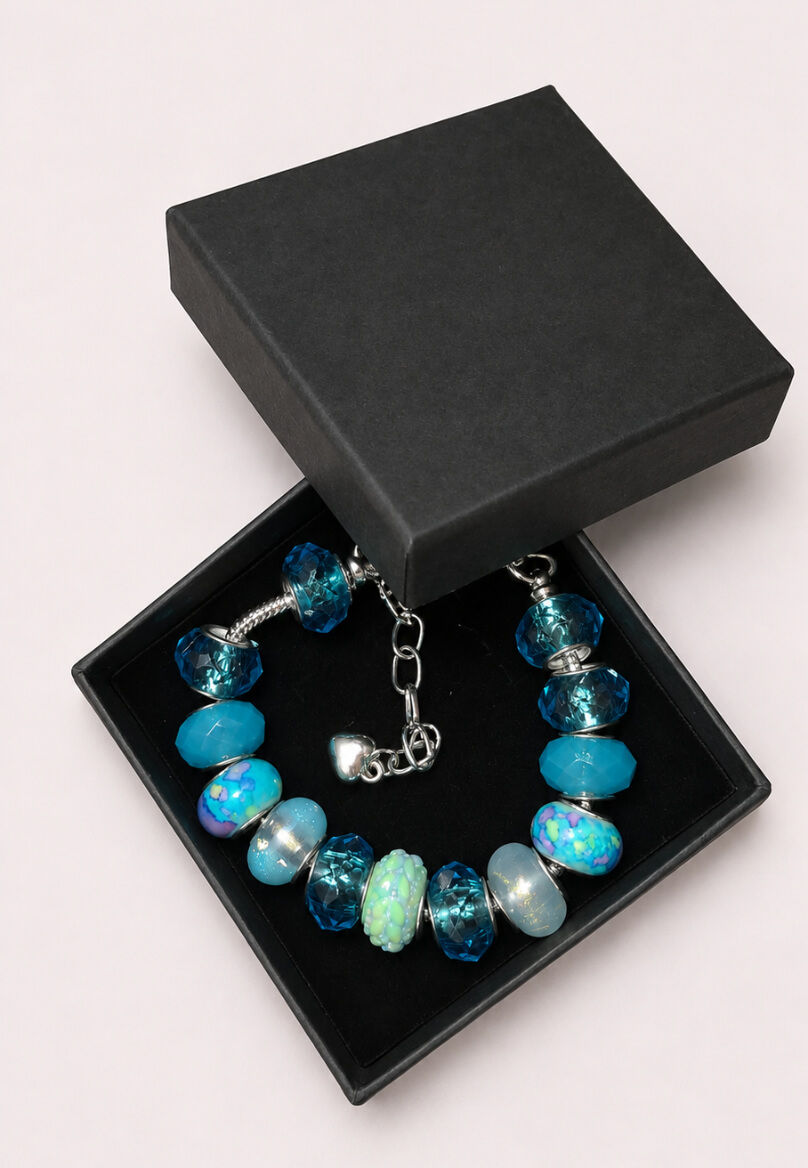 Ocean blue European charm bracelet presented in a black gift box