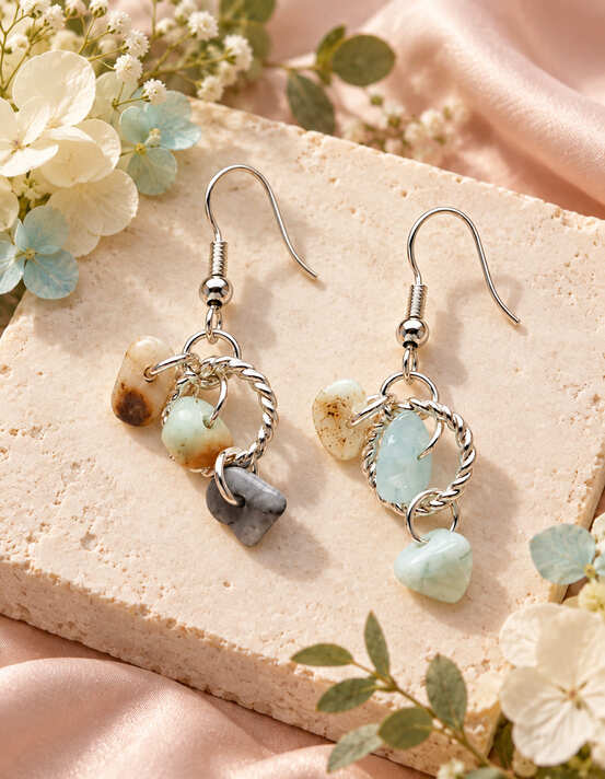 Sterling silver drop earrings with irregular blue green cream and grey natural stones in twisted ring designs