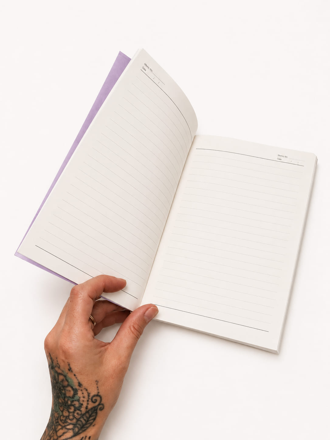 Open purple notebook measuring 21 x 14cm showing lined pages for journalling, planning and everyday notes