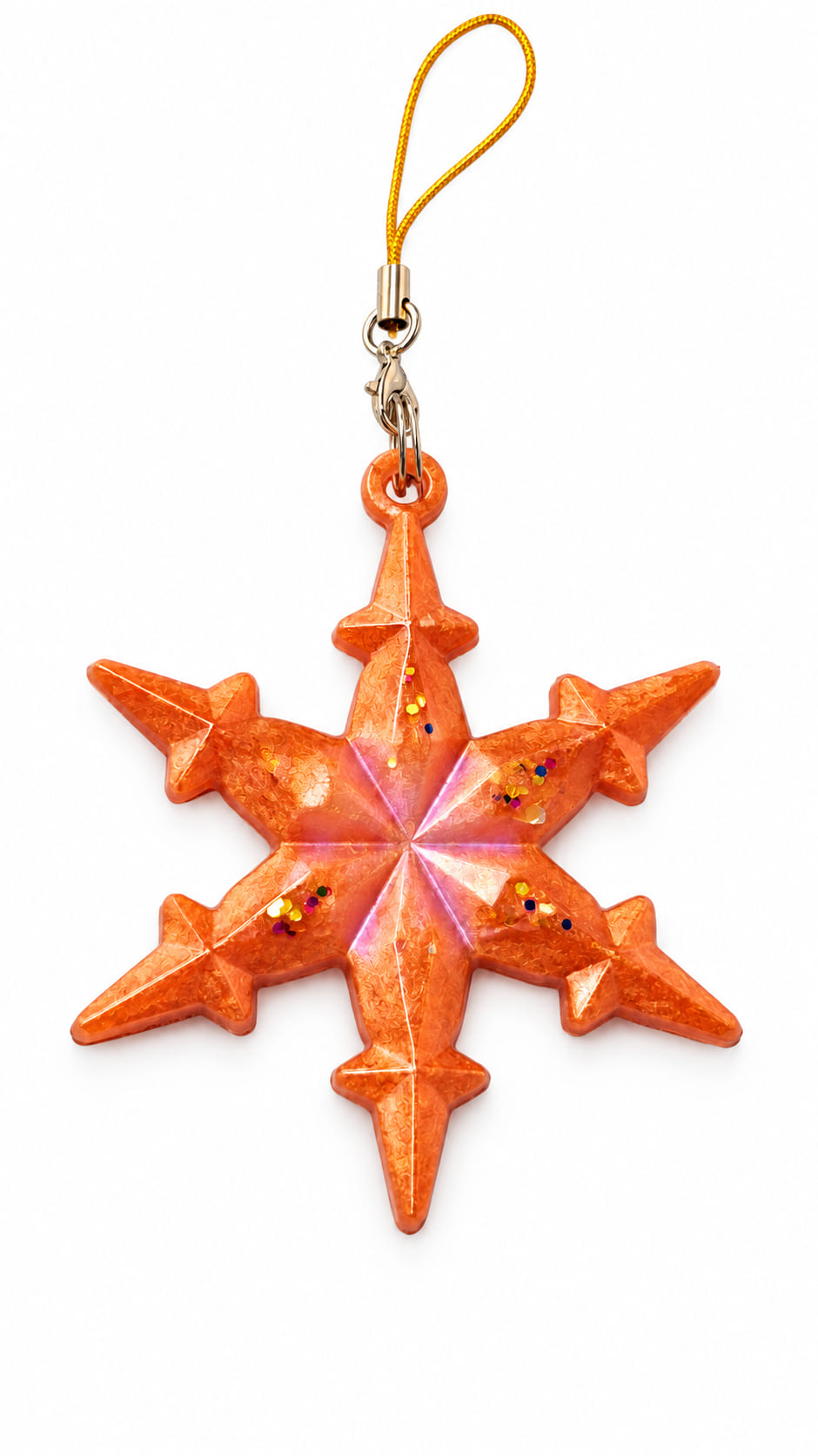Handmade orange epoxy resin snowflake Christmas decoration with glitter details and golden-orange hanging loop on a white background.