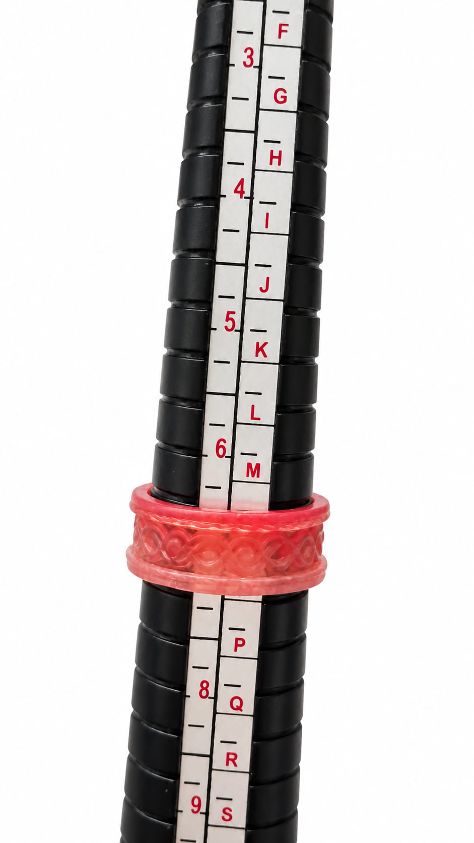 Handmade coral pink epoxy resin ring positioned on a ring sizing mandrel to show fit and band width.