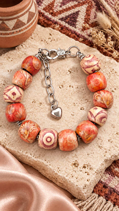 Handmade Desert Mosaic natural wood bead bracelet with terracotta, cream and brown patterned beads, silver-tone clasp and heart charm.