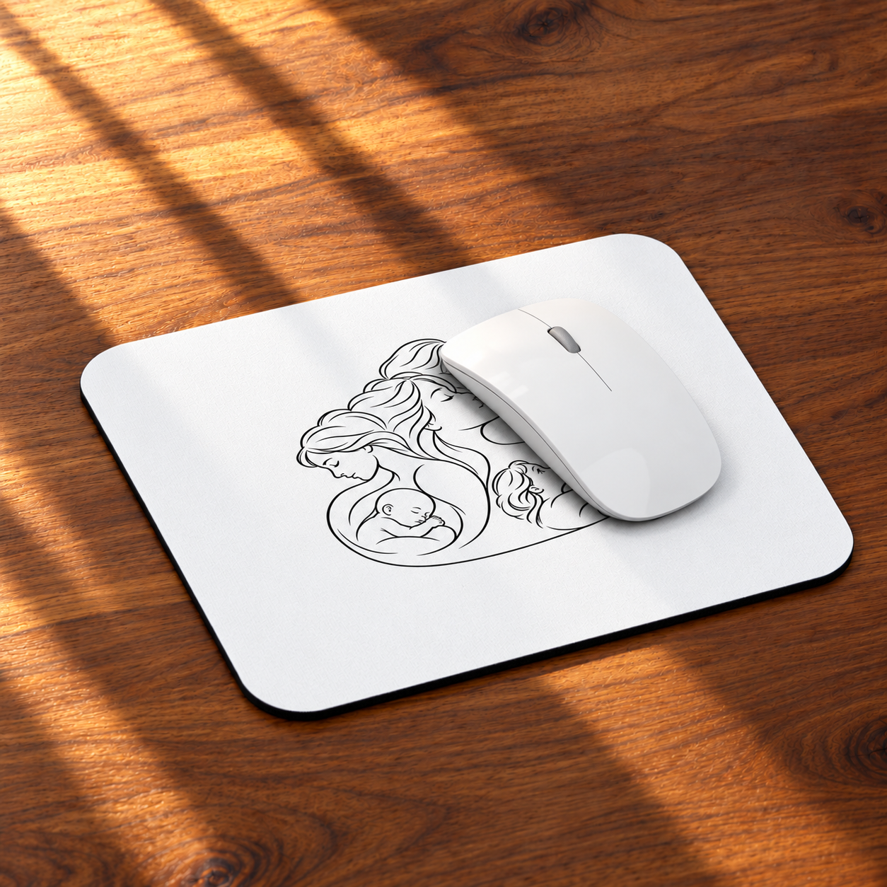 Angled view of the Motherhood mouse pad on a sunlit wooden desk with a white mouse on the pad.