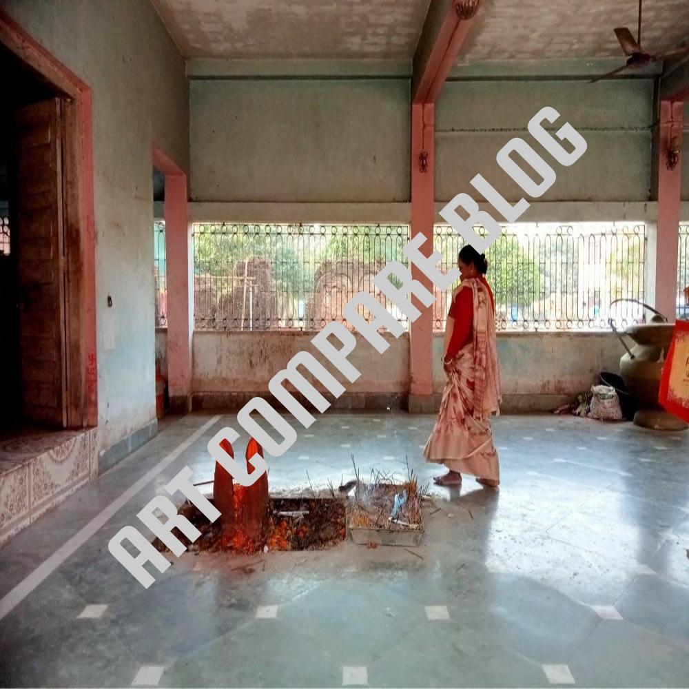Woman in Saree Walking Inside Open Temple Hall with Havan Kund Fire Pit and Iron Grilled Windows - Murshidabad Temple Interior