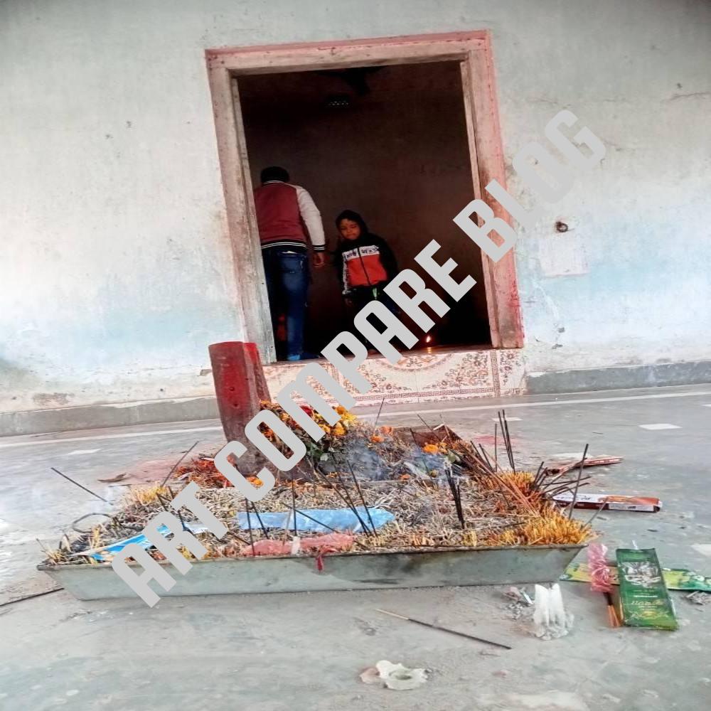 Incense Sticks and Flower Offerings at Small Havan Altar Outside Temple Sanctum Door with Devotees Inside - Murshidabad Temple Courtyard