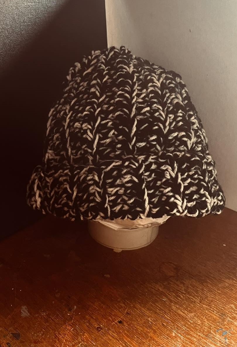 Handmade black and white crochet woolly hat, cosy two-tone winter beanie with an 8 x 9 inch folded measurement.