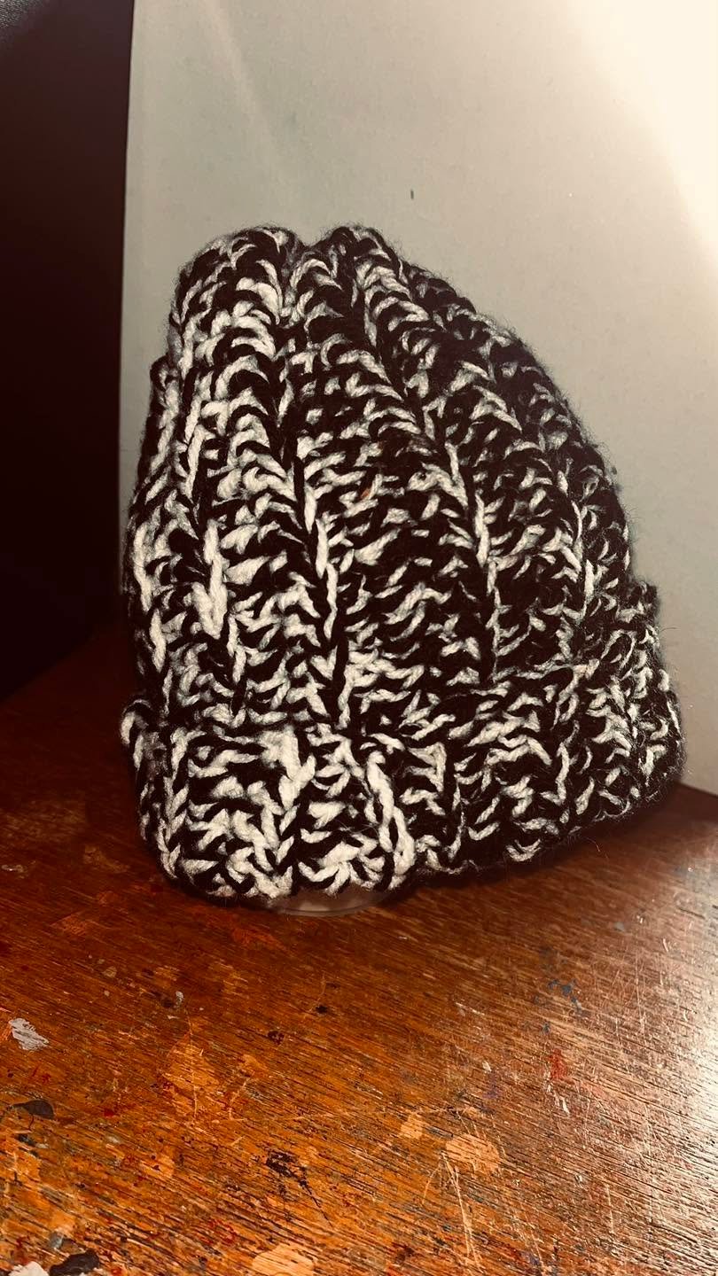 Handmade black and white crochet woolly hat, cosy two-tone winter beanie with an 8 x 9 inch folded measurement.