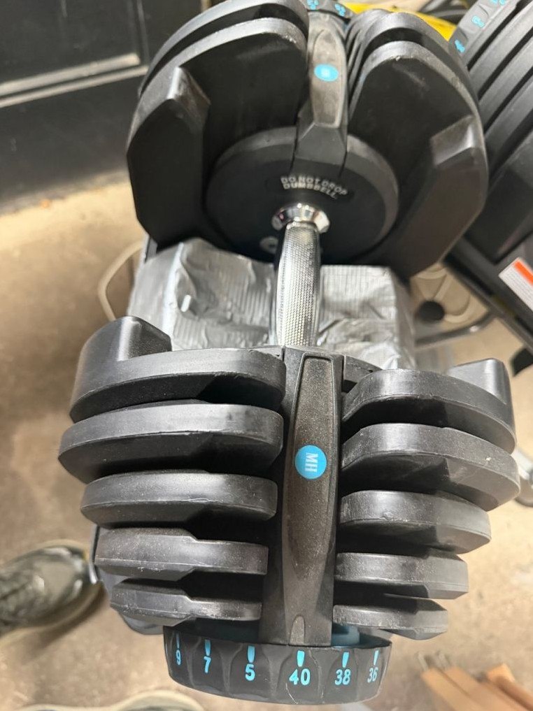 Set of adjustable dumbbells, each goes up to 40kg.